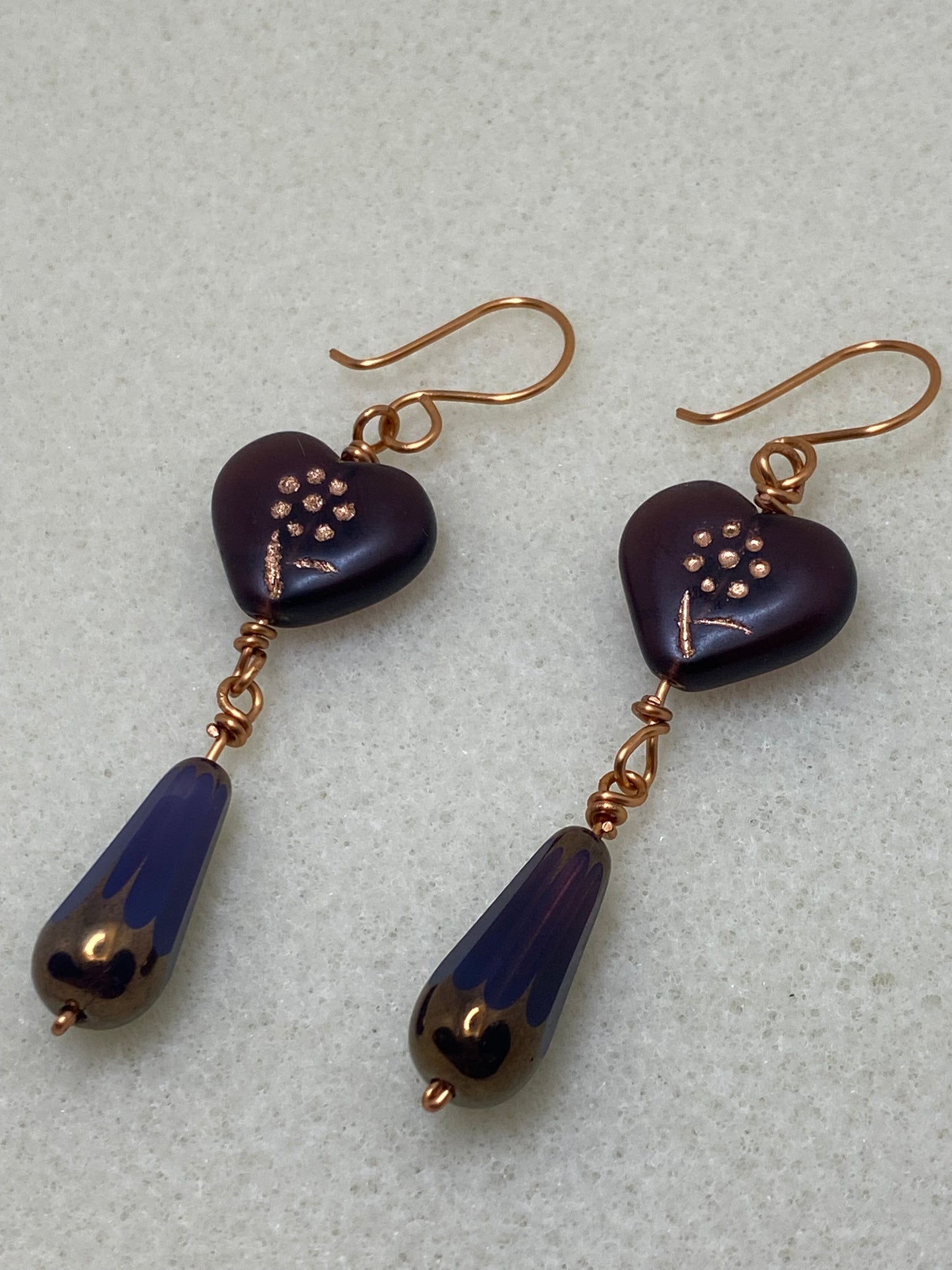Artisan copper drop earrings featuring Deep Purple Glass Heart with etched Flower design