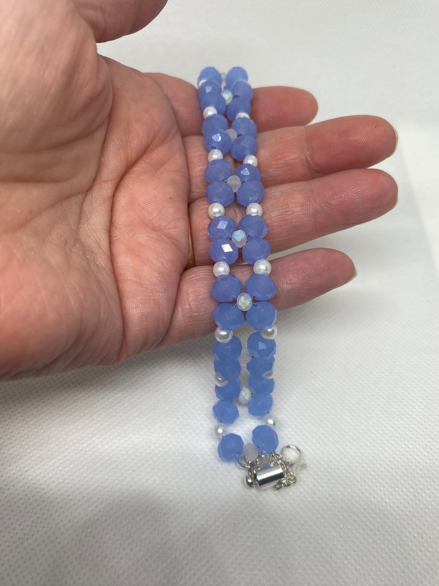 Sky Blue Crystal & Glass Pearl Beaded Bracelet with Silver Finished Stainless steel magnetic clasp.