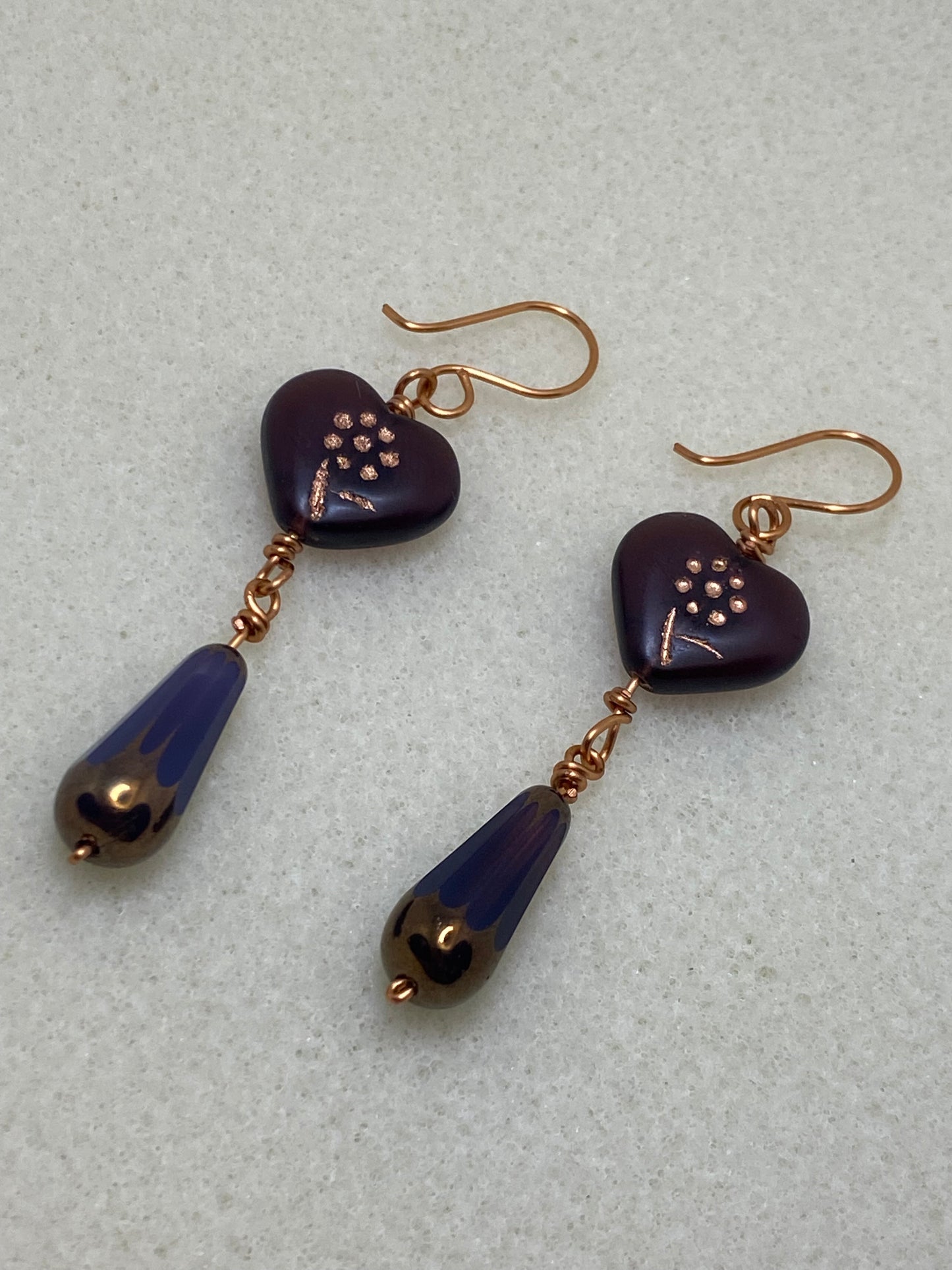 Artisan copper drop earrings featuring Deep Purple Glass Heart with etched Flower design