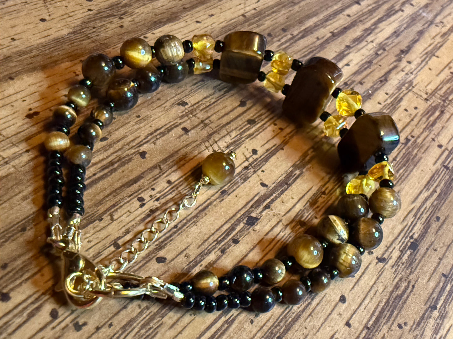 AAA Tiger Eye & Baltic Amber gemstone bracelet very chatoyant with gold plating.