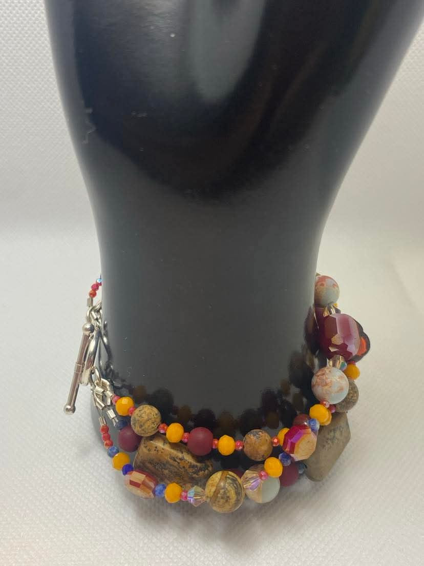 Arizona Sunset Bracelet Featuring: Picture Jasper, Red Jasper, Lapis Lazuli, Agate,, red colored Czech Glass Hibiscus Flower with Swarovski Crystals, & Sterling Silver toggle clasp