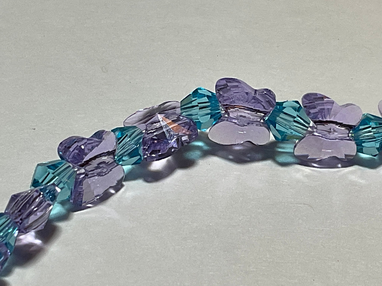 Artisan made Violet Butterfly & Aquamarine crystal Stretch bracelet. Handmade in Michigan!. Made using Swarovski Violet Butterfly Crystals.