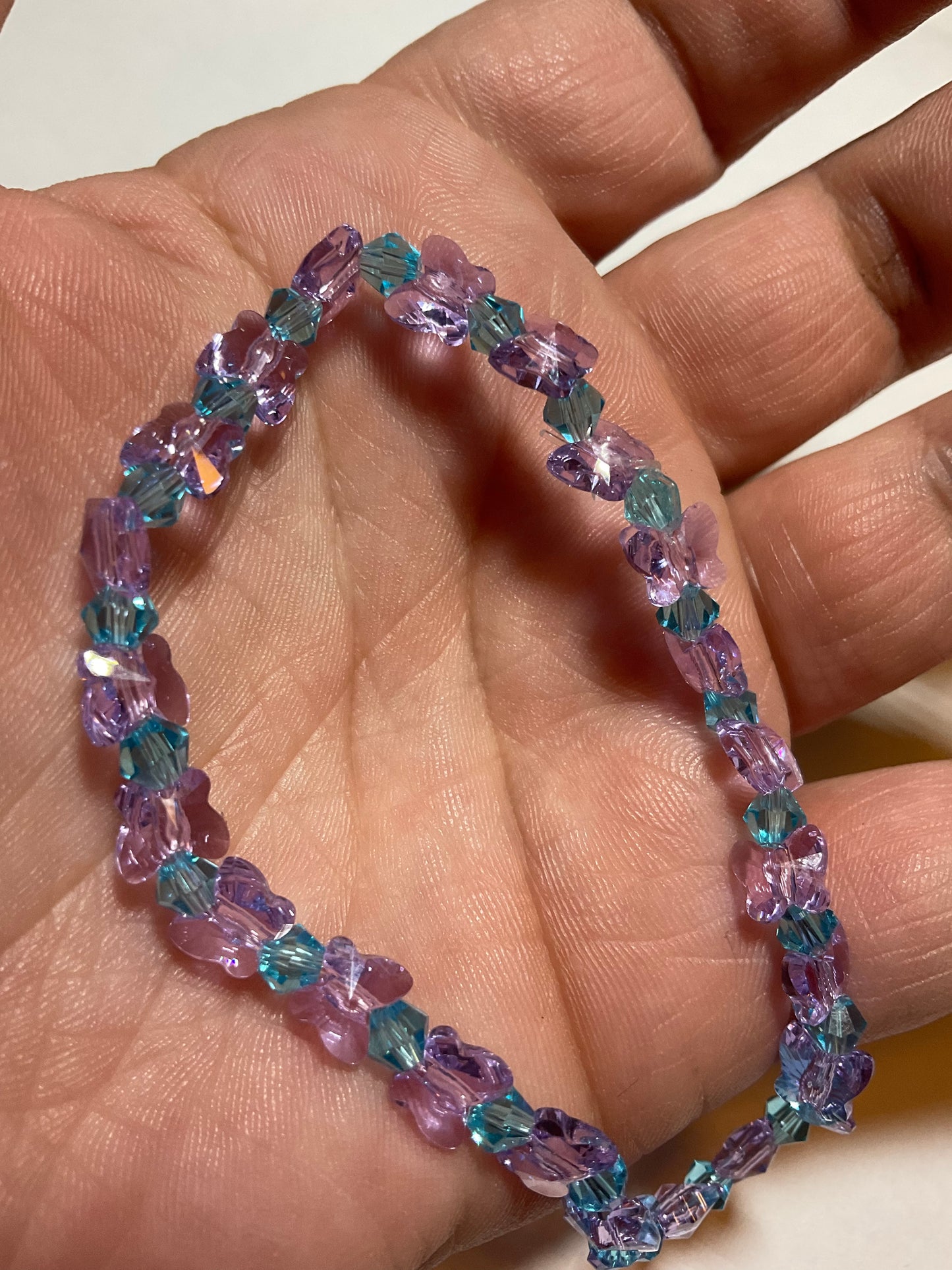 Artisan made Violet Butterfly & Aquamarine crystal Stretch bracelet. Handmade in Michigan!. Made using Swarovski Violet Butterfly Crystals.