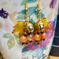 Bring on fall fun! Swaying Golden Acorns, Carnelian Gemstones and And Hand Painted Maple Leaves! Earrings feature Gold Plated Earring hooks, beads, and Acorns.