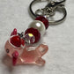 Adorable Axolotl w/Santa hat featuring stainless steel wire adorned with Sparkling Clear, & Red Crystals & Glass Pearls, Beautiful & Fun keychain/backpack/purse/tote charm