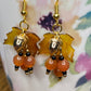 Bring on fall fun! Swaying Golden Acorns, Carnelian Gemstones and And Hand Painted Maple Leaves! Earrings feature Gold Plated Earring hooks, beads, and Acorns.