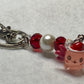 Adorable Axolotl w/Santa hat featuring stainless steel wire adorned with Sparkling Clear, & Red Crystals & Glass Pearls, Beautiful & Fun keychain/backpack/purse/tote charm