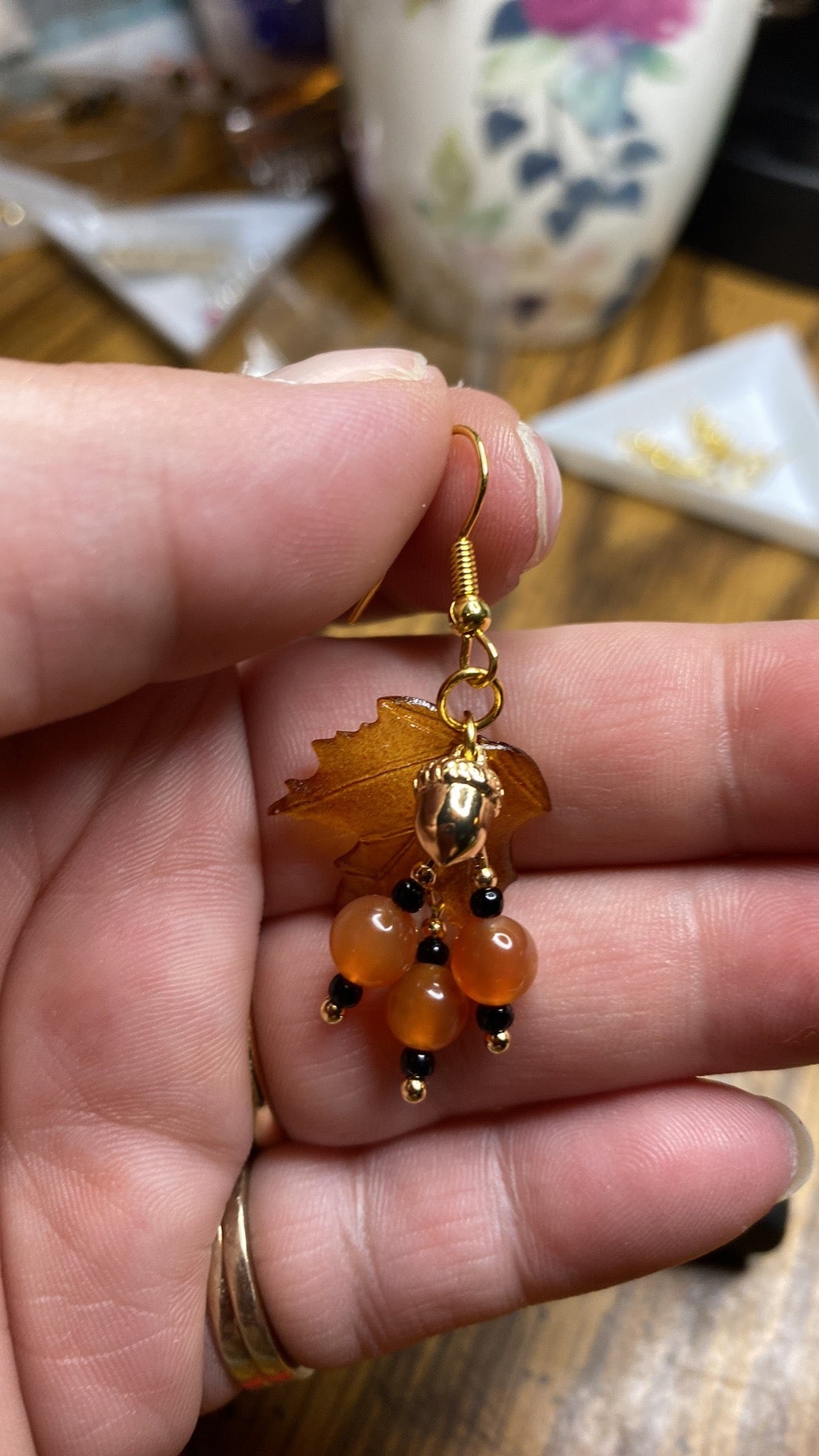 Bring on fall fun! Swaying Golden Acorns, Carnelian Gemstones and And Hand Painted Maple Leaves! Earrings feature Gold Plated Earring hooks, beads, and Acorns.