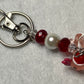 Adorable Axolotl w/Santa hat featuring stainless steel wire adorned with Sparkling Clear, & Red Crystals & Glass Pearls, Beautiful & Fun keychain/backpack/purse/tote charm