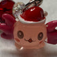 Adorable Axolotl w/Santa hat featuring stainless steel wire adorned with Sparkling Clear, & Red Crystals & Glass Pearls, Beautiful & Fun keychain/backpack/purse/tote charm