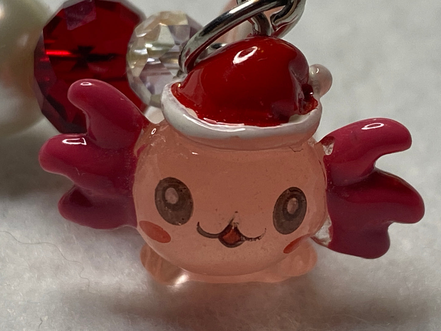 Adorable Axolotl w/Santa hat featuring stainless steel wire adorned with Sparkling Clear, & Red Crystals & Glass Pearls, Beautiful & Fun keychain/backpack/purse/tote charm