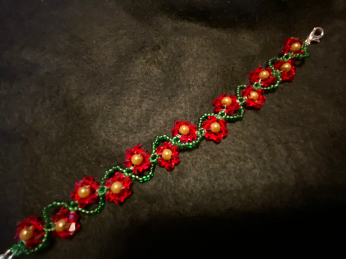 Artisan crafted Red Precosia Crystal Beaded Poinsettia Bracelet