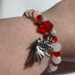 White Quartz, Crystal Siam  corner cut cubes, and Chakra gemstones with a dainty Tibetan silver fairy dangling.