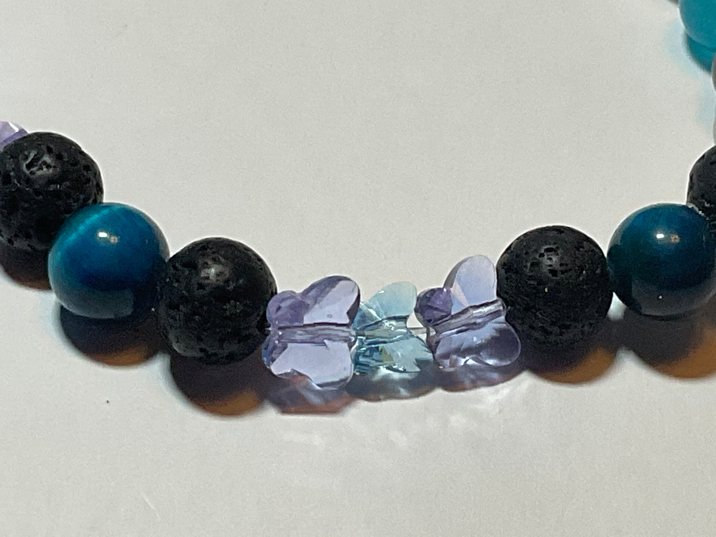 Artisan Semiprecious Stone Energy Stretch Bracelet with an added touch of dainty Swarovski Crystal Butterflies in Aqua & Violet