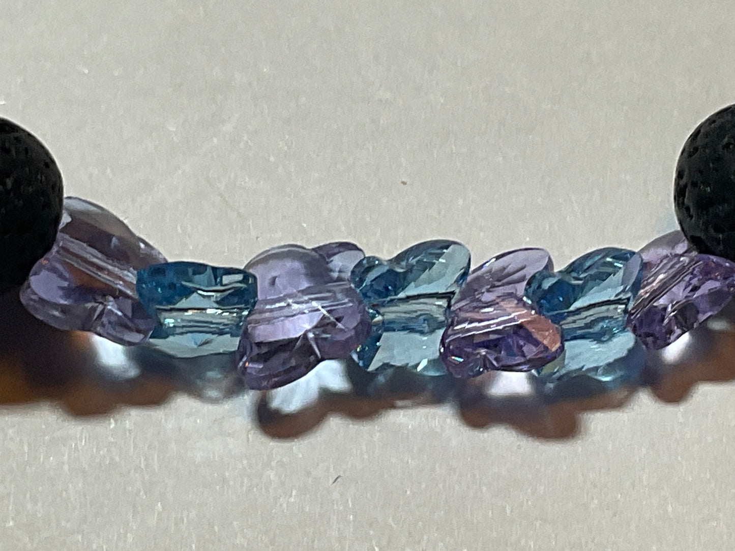 Artisan Semiprecious Stone Energy Stretch Bracelet with an added touch of dainty Swarovski Crystal Butterflies in Aqua & Violet